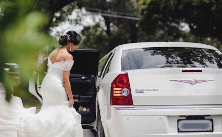 bride riding a limousine on her wedding day